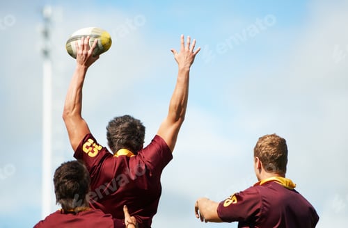 Preview: Its a mans world. Rearview shot of a young rugby player catching the ball during a lineout.