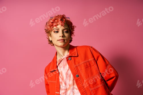 Preview: Vibrant Elegance: Woman in Orange Jacket Pose