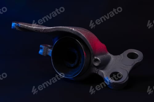 Preview: new car suspension detail, silent block on a black background