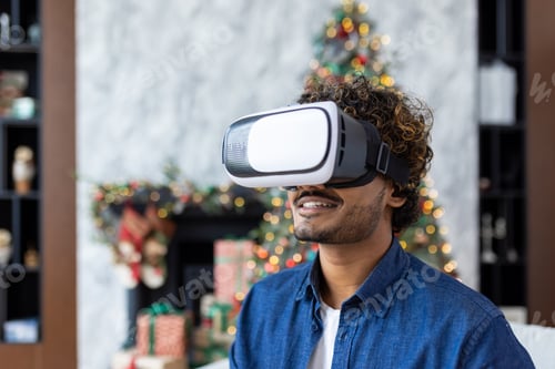 Preview: A man is using a virtual reality simulator for Christmas, sitting on a sofa in the living room of