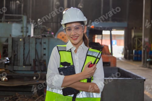 Preview: Two engineers in a steel mill Consult the size of the steel workpiece.