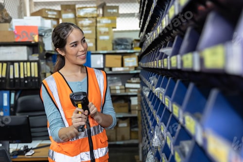 Preview: happy woman worker engineer technician staff work in factory products parts inventory warehouse