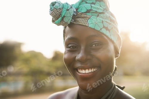 Preview: African american woman smiling on camera outdoor at city park - Focus on mouth