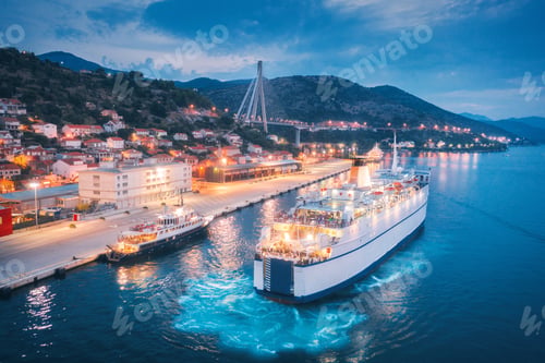 Preview: Aerial view of cruise ship in port at night. Landscape