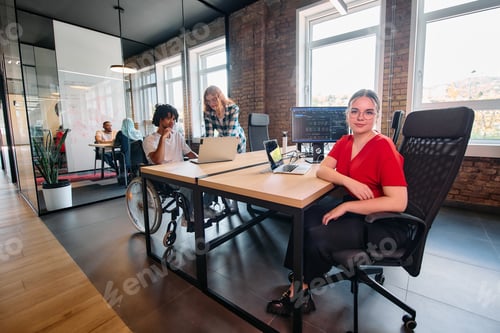 Preview: A diverse group of business professionals collaborates in a modern startup coworking center