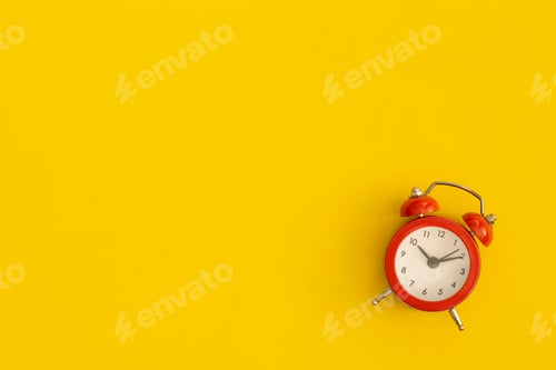 Preview: Red alarm clock with space for text on yellow background