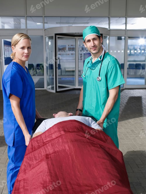 Preview: Doctor and nurse with patient on gurney