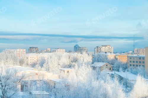 Preview: City view in winter. Houses and trees in snow. Beginning of winter season. Frosty air over city.
