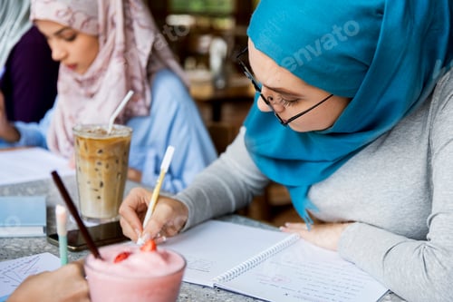 Preview: Islamic friends discussing and reading books together
