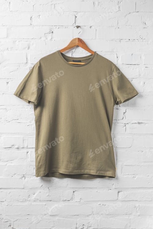Preview: one brown shirt on hanger on white wall