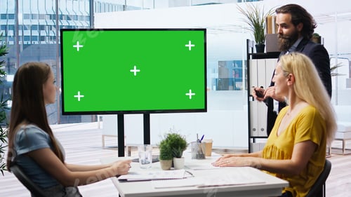 Preview: Financial advisor analyzing customers market shares on chroma key display