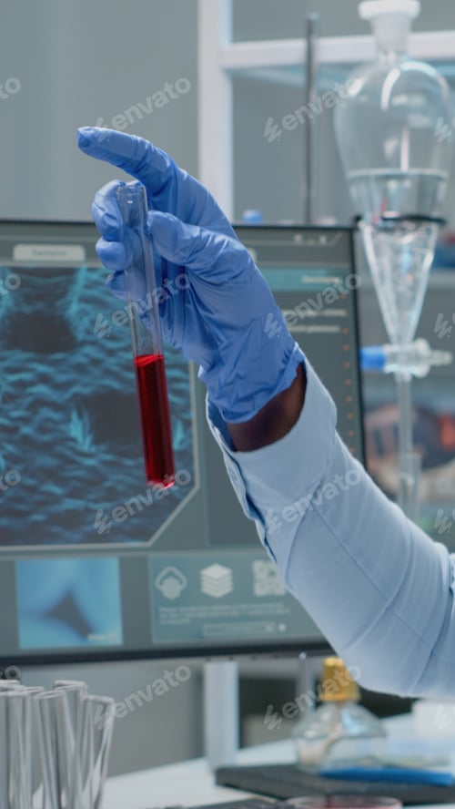 Preview: Science specialist studying test tube with blood sample