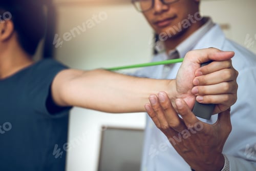 Preview: physical therapist descent working and helping to protect the hands of patients