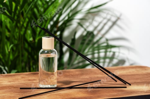 Preview: Glass Diffuser Bottle With Wooden Sticks on Wooden Tabletop
