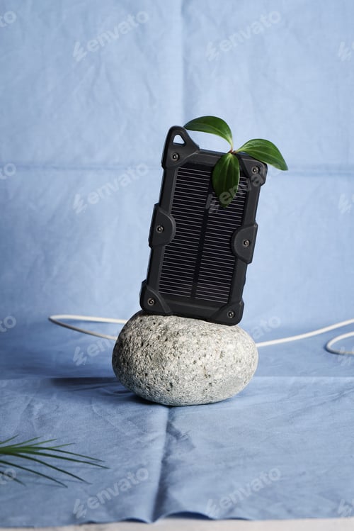 Preview: cheapest source of electricity. power box, portable solar battery for phone on stone