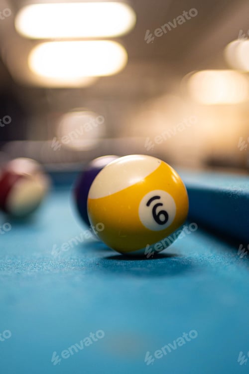 Preview: Vertical shot of the number 9 billiard ball in a blur
