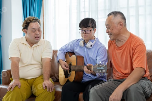 Preview: Autistic disabled children are having fun playing the guitar and singing with their families.