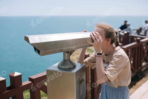 Preview: A teenage girl tourist looking at the sea in Antalya
