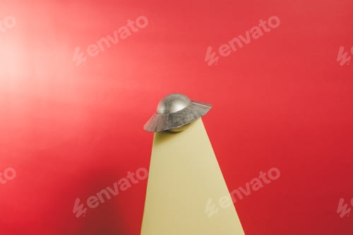 Preview: UFO and tractor beam with a red background