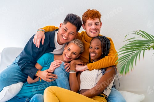 Preview: Lgtb couples of gay boys and girls lesbian in a portrait on a sofa at a house party