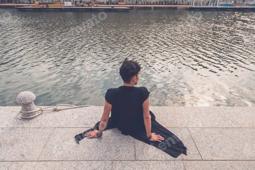 Preview: Handsome Asian model sitting by an artificial basin