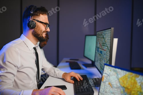Preview: Portrait of man working via headset microphone while sitting on navigation controller board