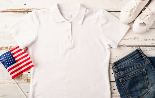 Preview: Mockup design white polo t shirt for logo, top view on white wooden background with US flag, shoes a
