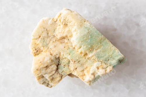 Preview: sample of raw amazonite rock on white marble