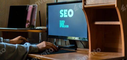 Preview: search engine optimization text on computer monitor, person at the workplace concept f