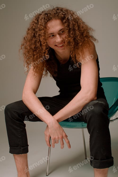 Preview: Attractive And Stylish Guy With Curly Hair And A Sports Figure
