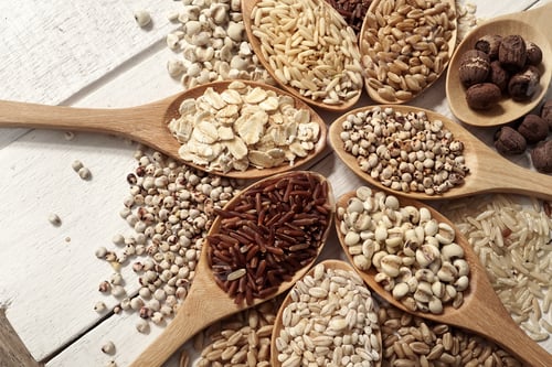 Preview: Cereals In The Spoons On The White Wooden Table Background