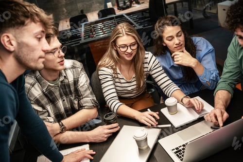 Preview: Programmers work alongside their colleagues in an office