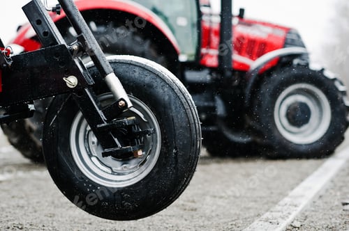Preview: Wheel of new red agricultural seeder close up view
