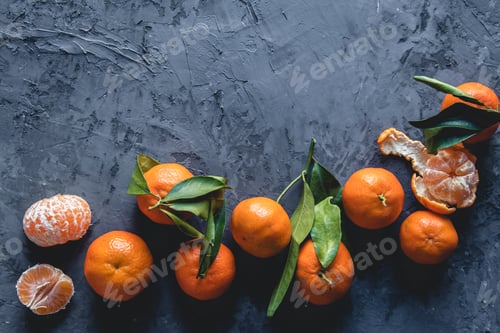 Preview: Juicy ripe tangerines with leaves on wooden table