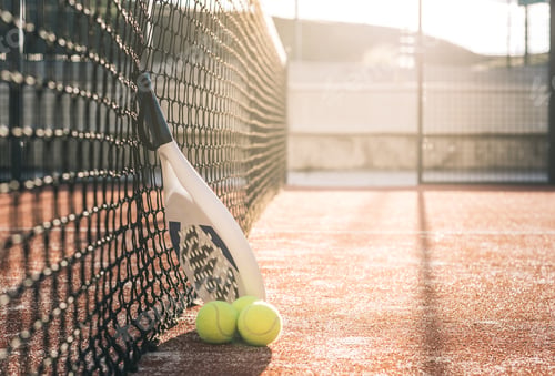 Preview: Padel blade racket resting on the net