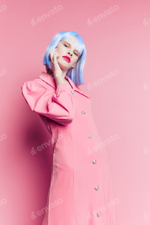 Preview: portrait of a woman in blue wig pink dress red lips isolated background