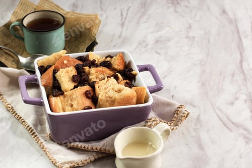 Preview: Cinnamon Bread and Butter Pudding with Raisins in Purple Square Baking Dish.