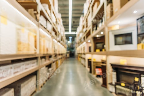 Preview: blurred view of shelves with boxes in warehouse