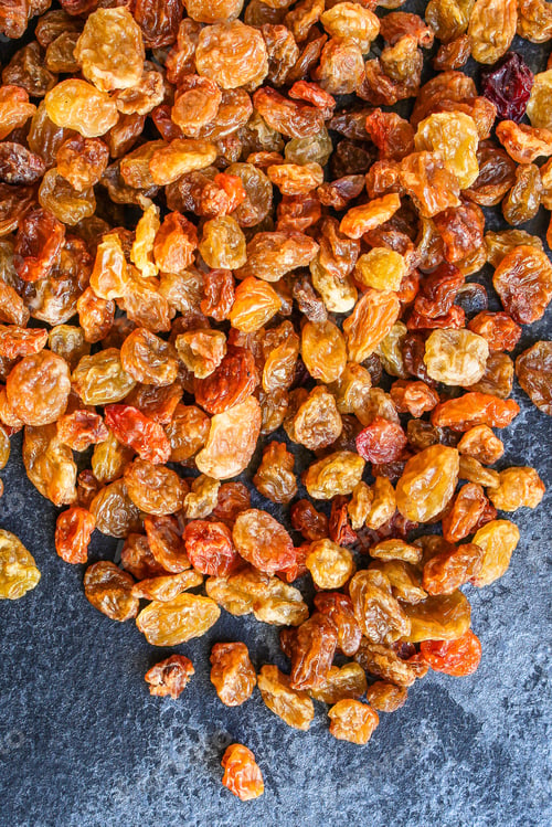 Preview: Raisins, Delicious Dried Grapes (Fresh Fruit Vitamins) Menu Concept Background. Top View. Copy Space