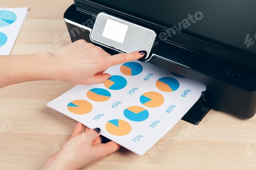 Preview: Female secretary making photocopies on xerox machine in office