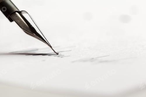 Preview: Close view of a pen writing on white paper during daylight