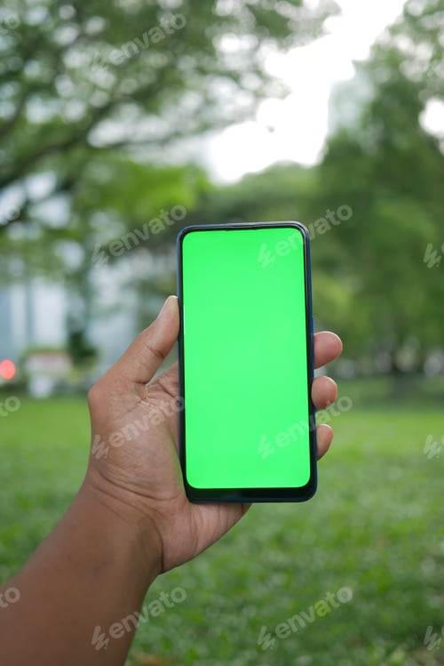 Preview: rear view of young man using smart phone at outdoor
