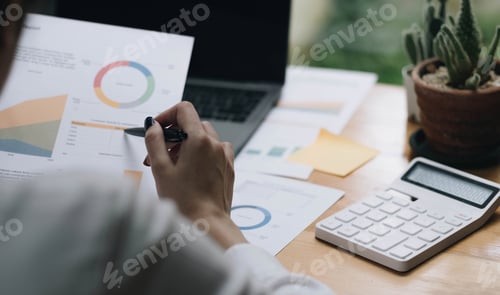 Preview: Asian accountant woman working audit budget and finance of company on wooden desk in office. consult