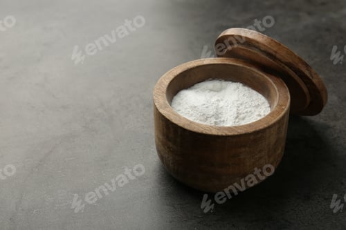 Preview: Baking powder in bowl on grey textured table, space for text