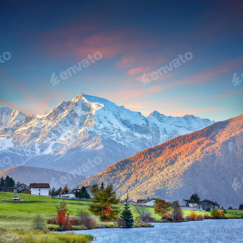 Preview: Gorgeous autumn view of Haidersee (Lago della Muta) lake with Ortler peak on background.