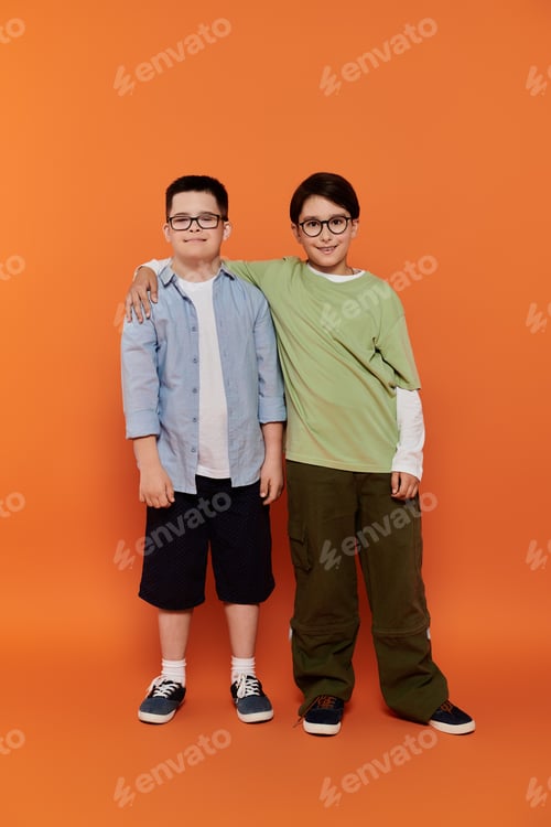 Preview: Two Boys Posing Against an Orange Background