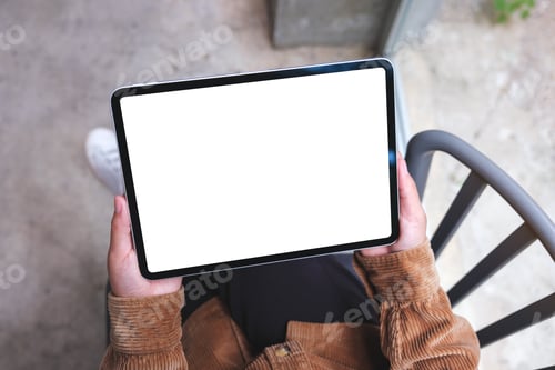 Preview: Top view mockup image of a woman holding digital tablet with blank white desktop screen