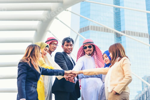 Preview: Diversity multiethnic high five group of business people success team hands together