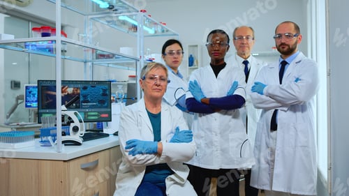 Preview: Professional multiethnic medical staff looking at camera