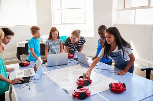 Preview: Group Of Students In After School Computer Coding Class Learning To Program Robot Vehicle